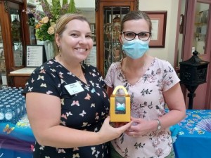 Stacey, Butterfly Lead at Alexander Place, shares a takeaway gift at their launch celebration!