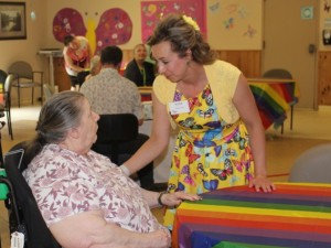 Alicia, Butterfly Lead at Temiskaming Lodge, chats with a resident at their launch celebration.